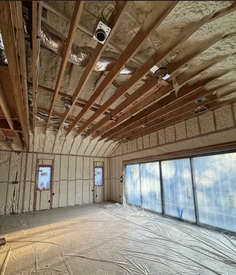 Interior walls and ceiling insulated with spray foam during new construction in Gas City